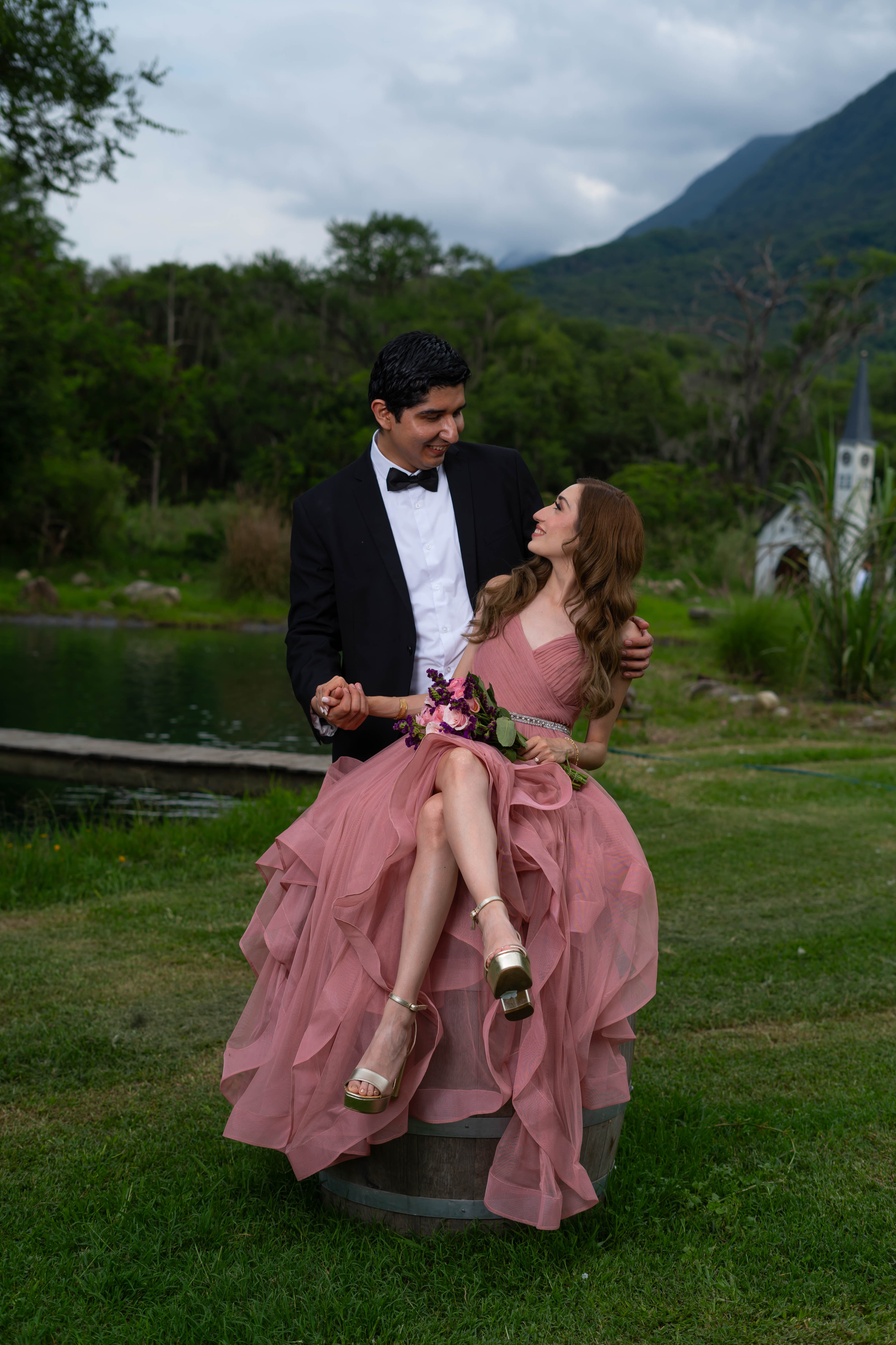 The couple laughing together outdoors